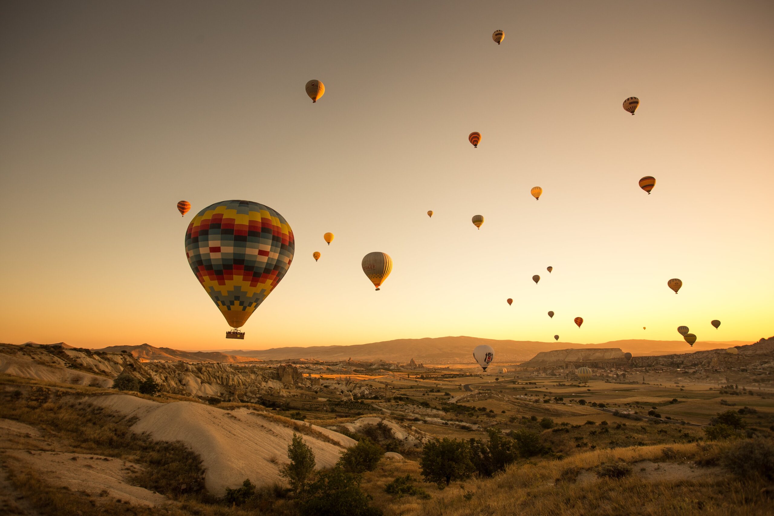 set-colored-balloons-flying-ground-cappadocia-turkey-min